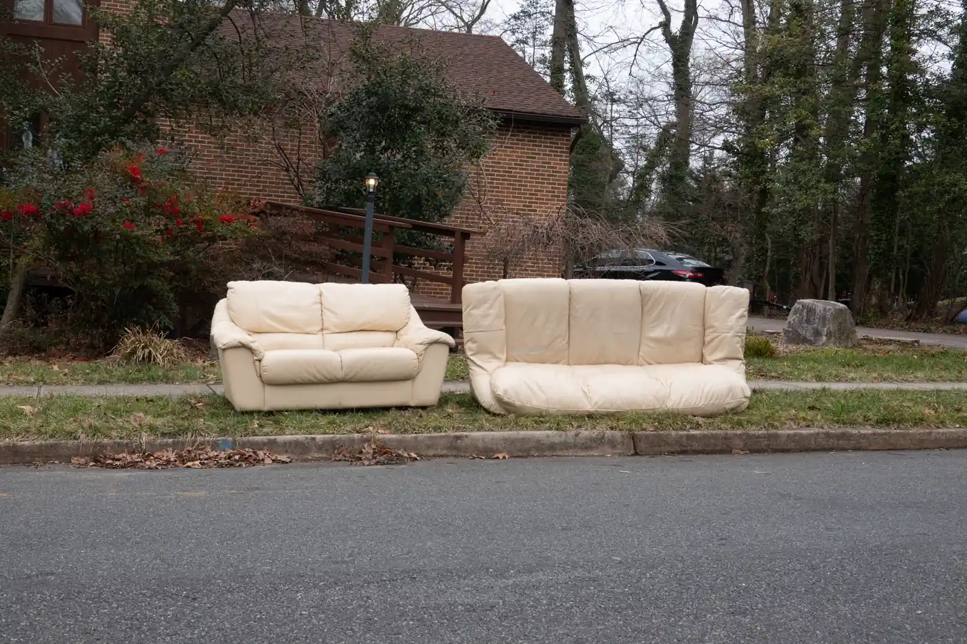 Two couches left at the curb for pickup